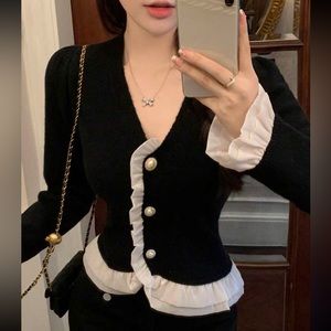 Black Conor cardigan with white ruffle detail